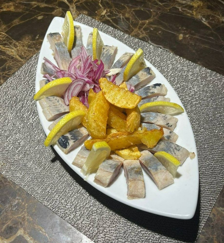 Оселедець з цибулею